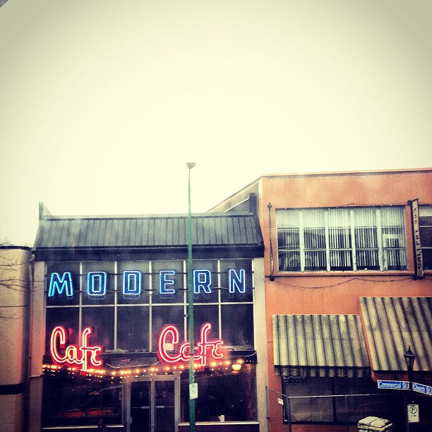 The Modern Cafe storefront at dusk